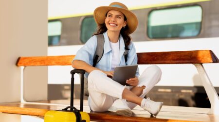 A woman sitting on a bench and wants to travel