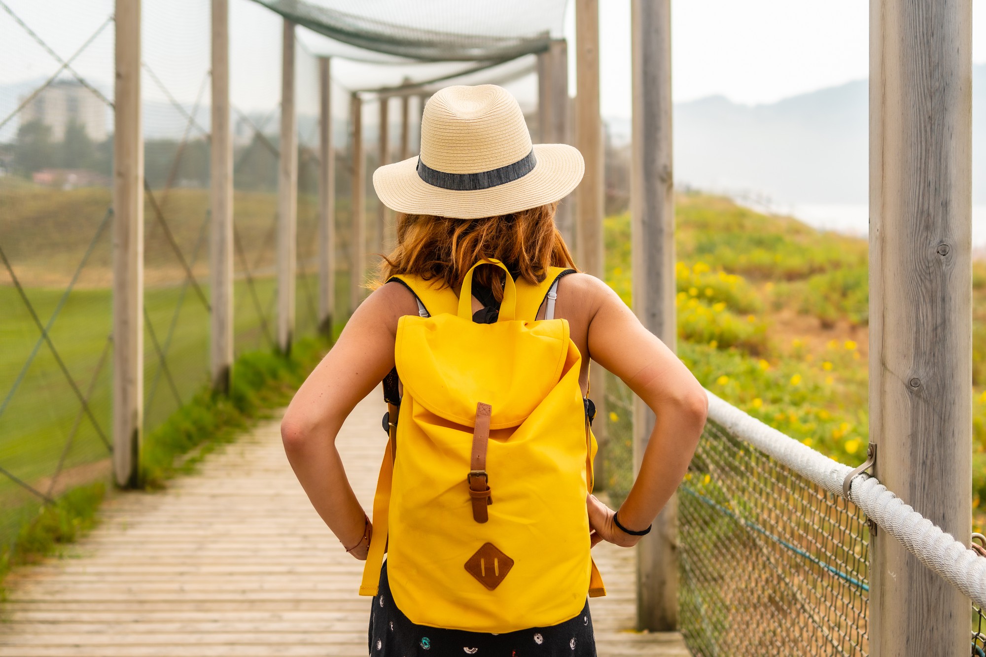 A woman with backpack who traveled alone