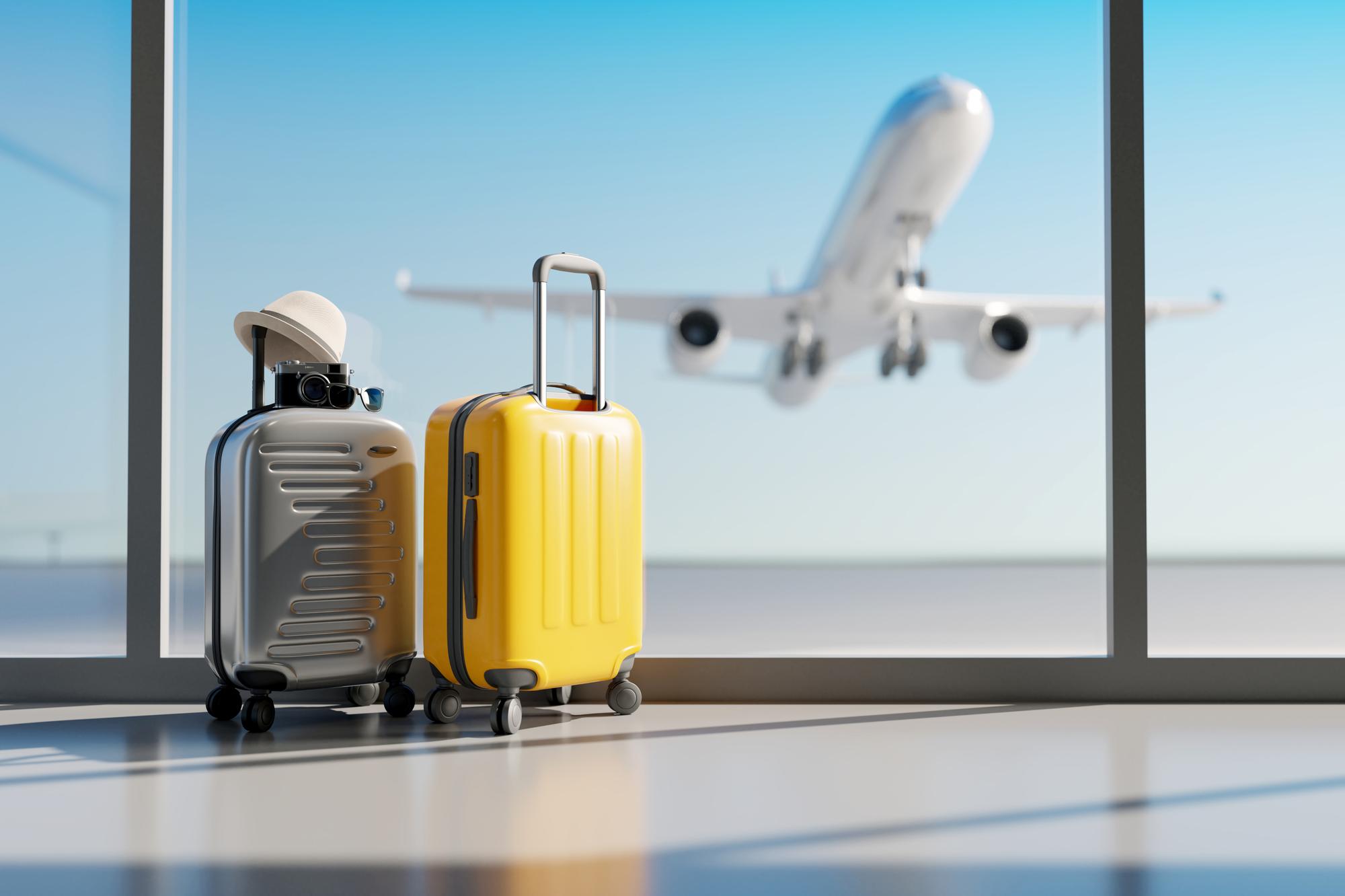 Grey and yellow suitcase in airport