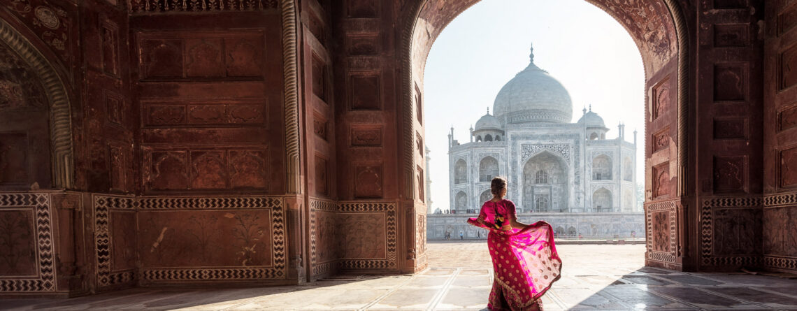 A woman with red saree stayed in Taj mahal