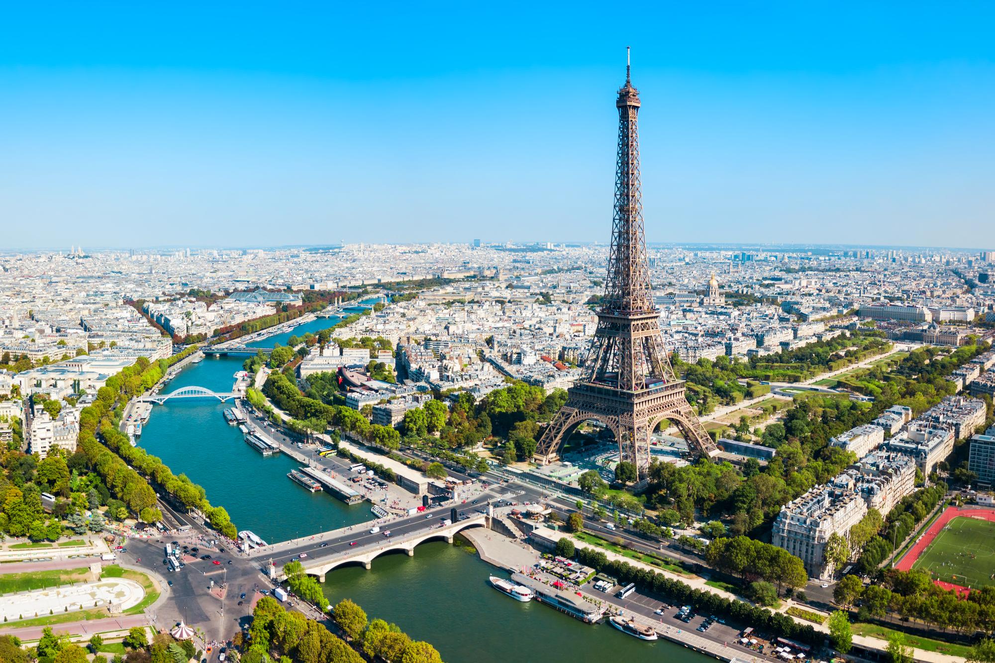 view of the Eiffel tower by the river in Paris