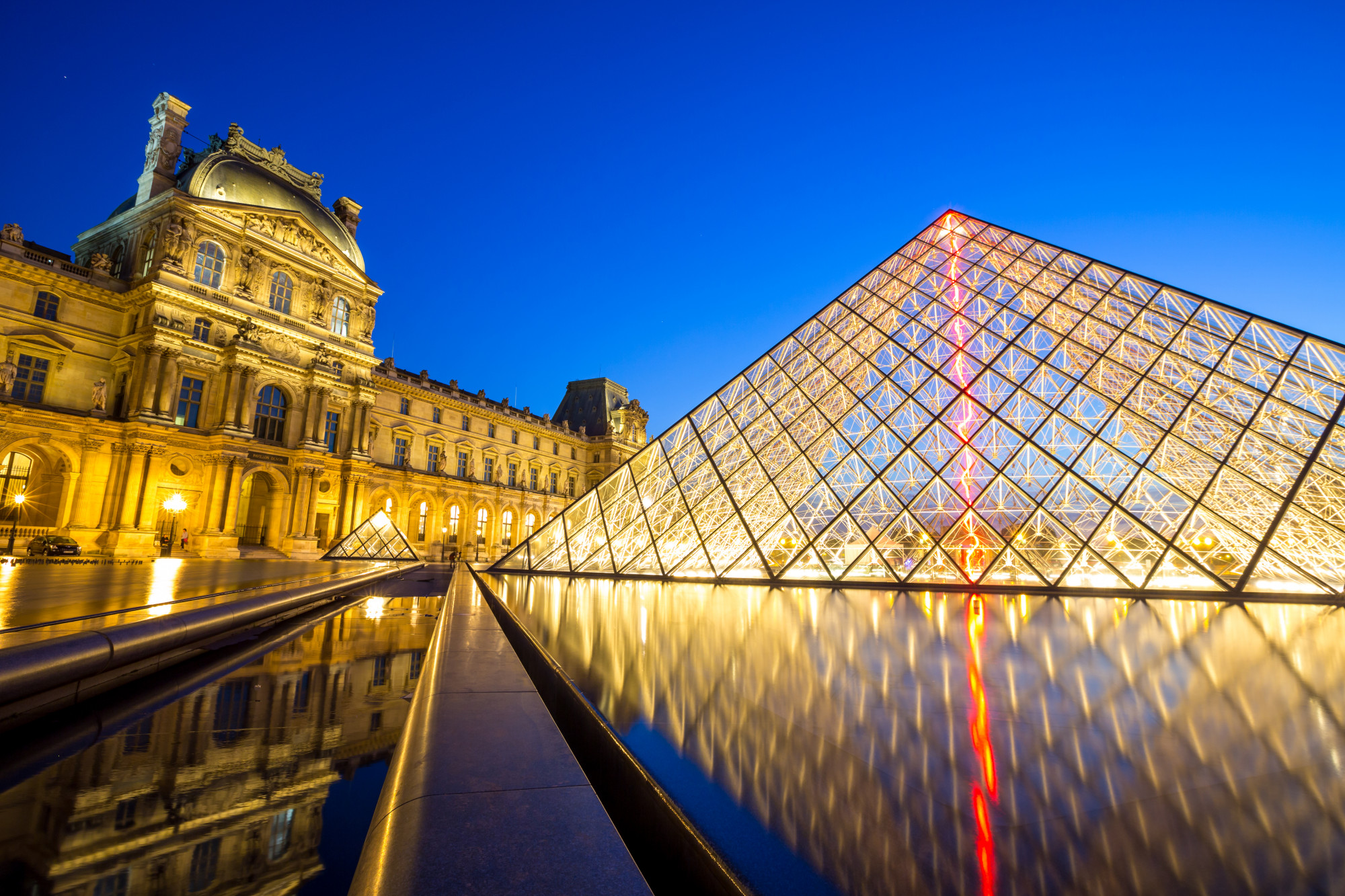 louvre museum in Paris at night