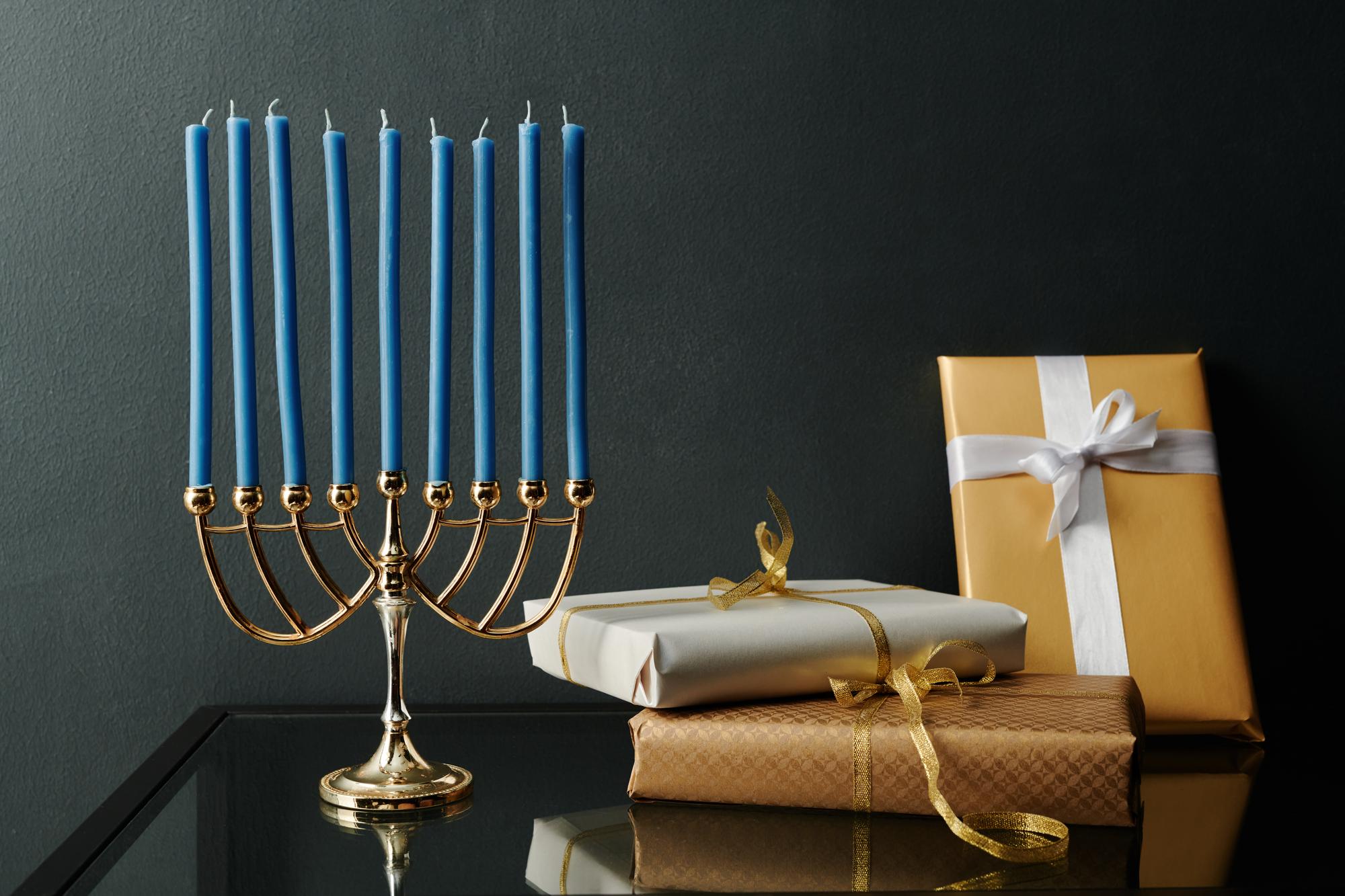 nine-blue-candle-menorah-standing-table-heap-packed-presents