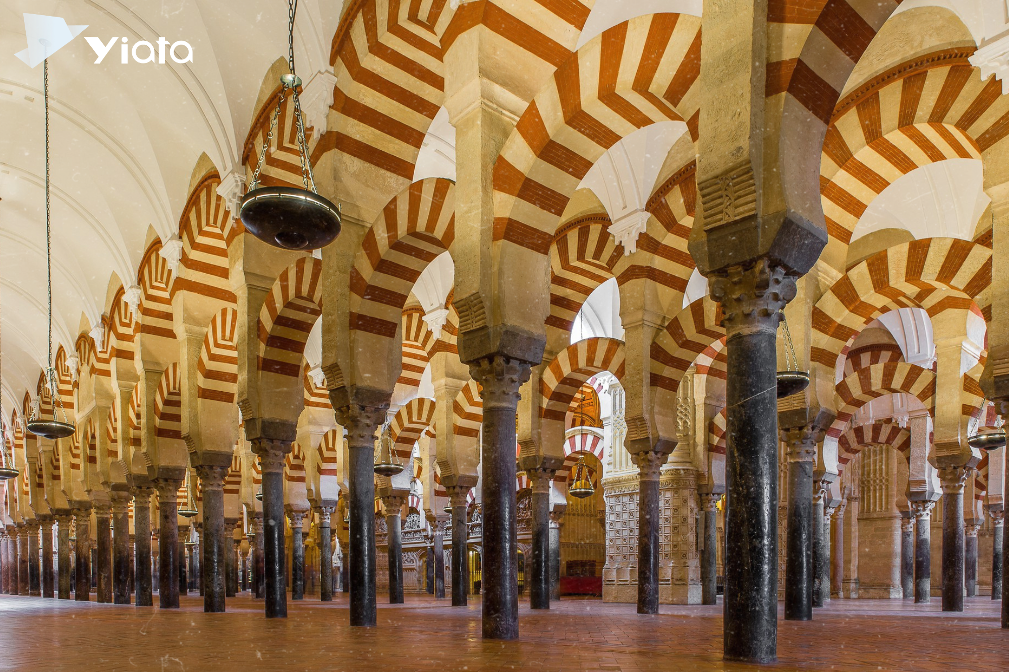 low-angle-shot-patterned-columns-lined-up-inside-majestic-cathedral-spain